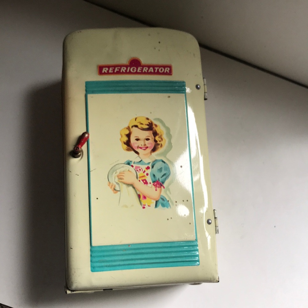 Vintage metal toy refrigerator.